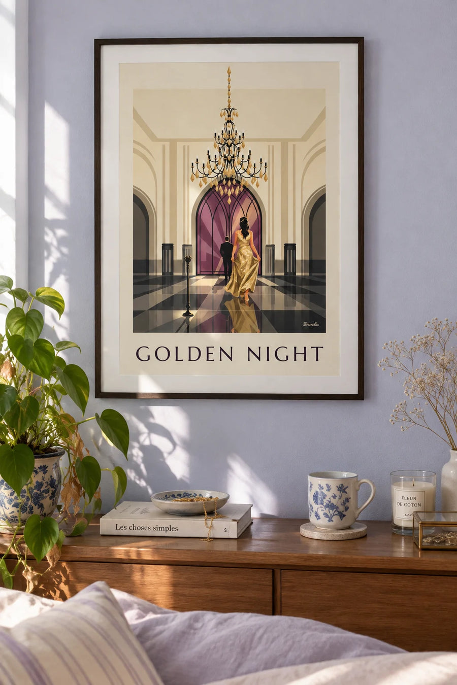 Poster of a woman in a sparkly gold dress beneath a ballroom chandelier: framed on the wall