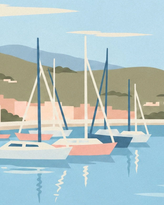 The sailing boats with tall masts and white and pink hulls on the blue harbour water