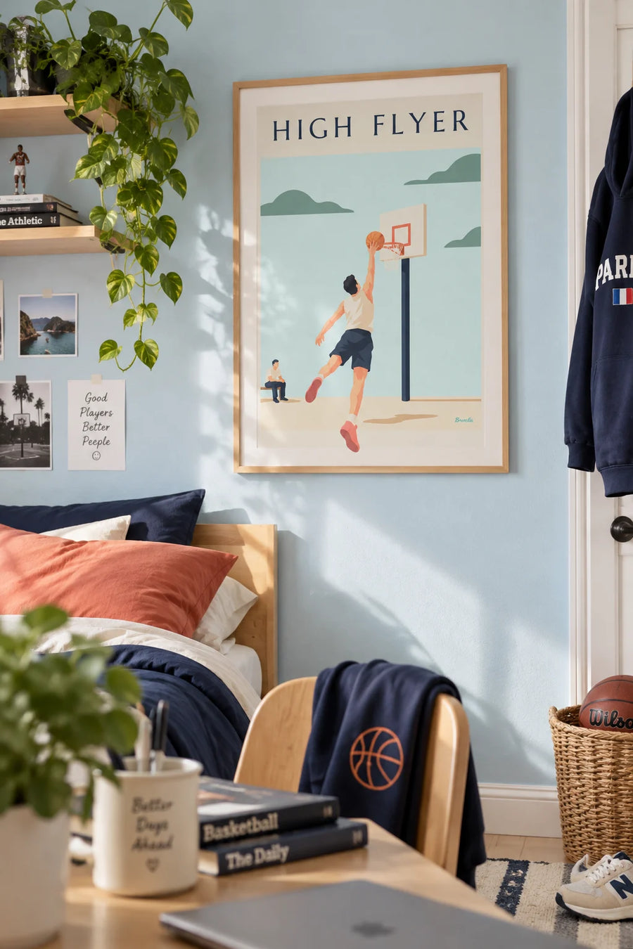 Poster of a basketball player soaring toward the hoop for a dunk: framed on the wall