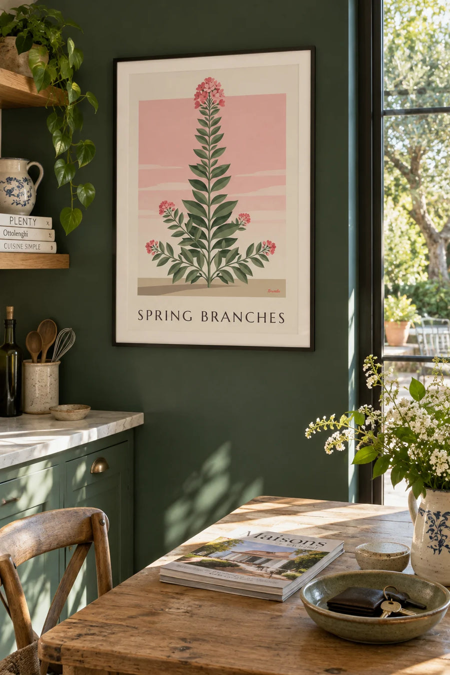 Poster of leafy branches and pink spring flowers: framed on the wall