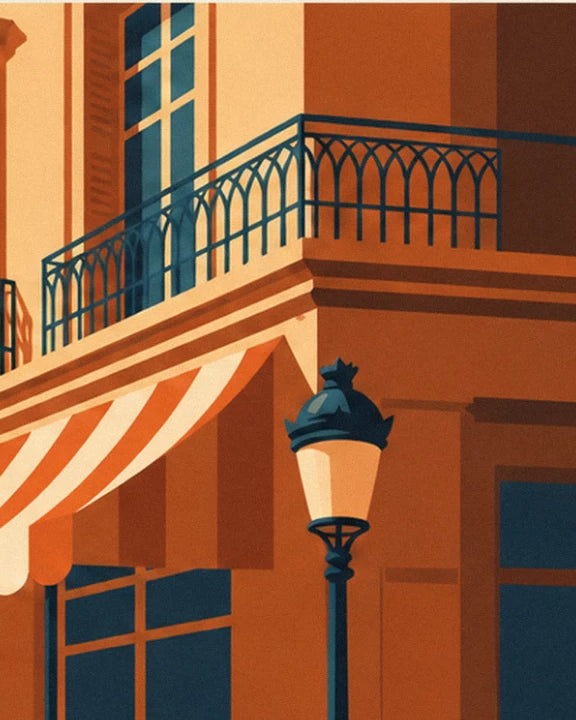 The midnight blue wrought iron balcony above an orange and white awning, with its street lamp