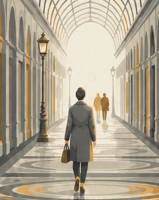 A woman in a grey coat with her brown bag, beneath the passage lamps