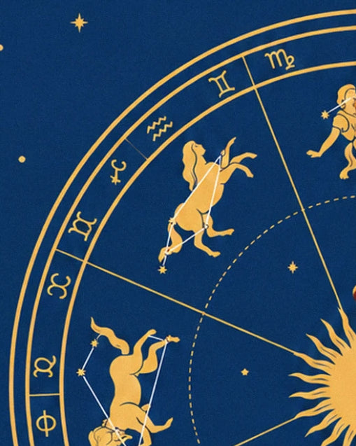 Golden creatures linked by stars on the zodiac circle, with a sun at the edge of the frame