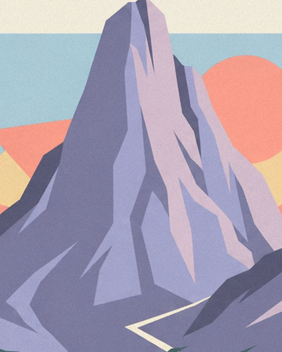 The peak with mauve and pink rock faces against the coral sun and blue sky