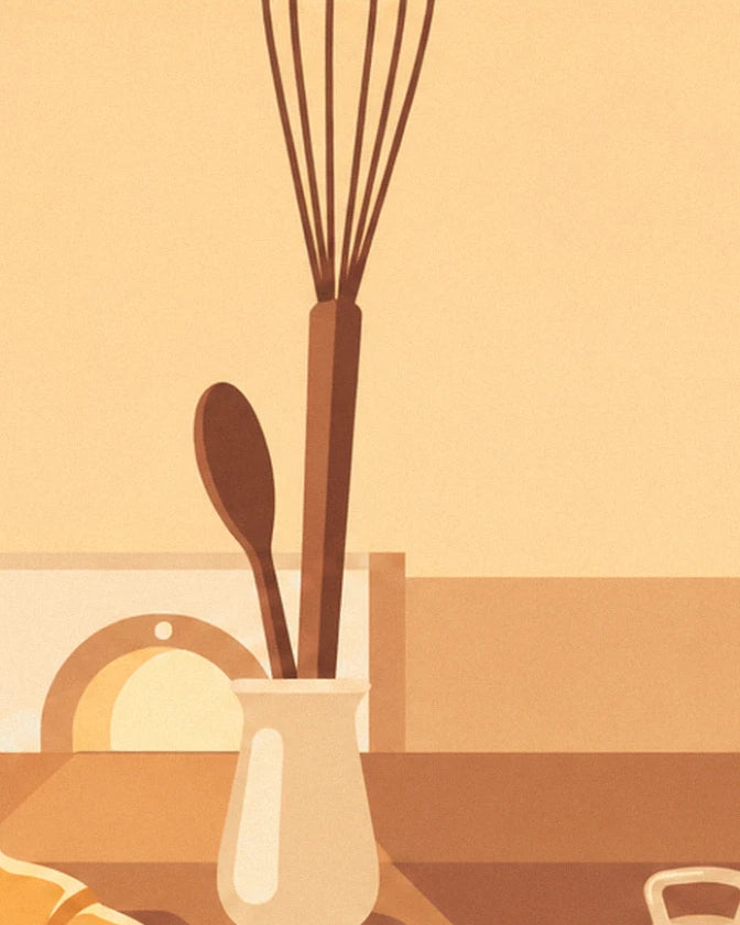 The whisk and wooden spoon in their cream pot, in front of the oven window