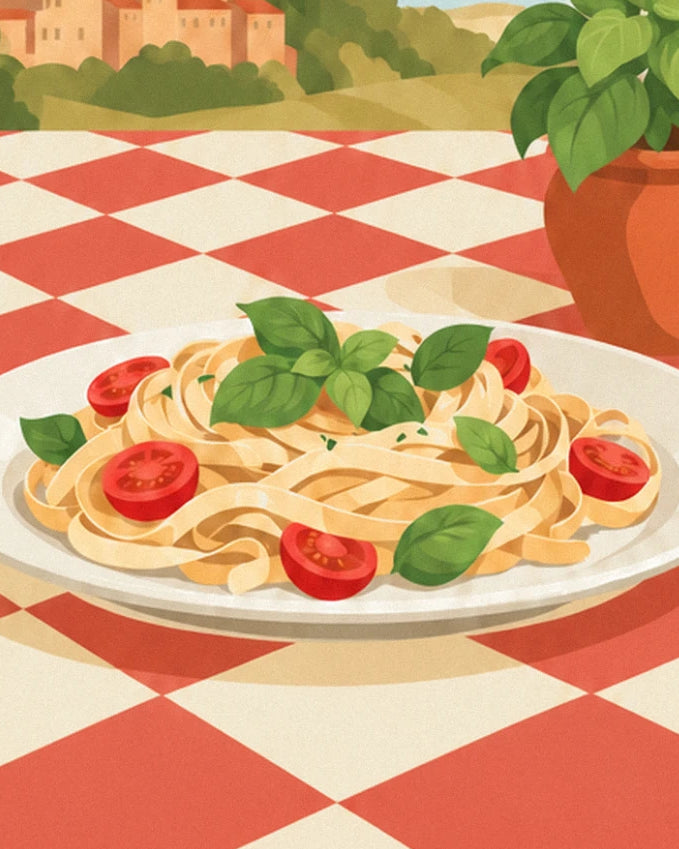 Assiette de tagliatelles au basilic et aux tomates cerises, sur la nappe à carreaux rouges