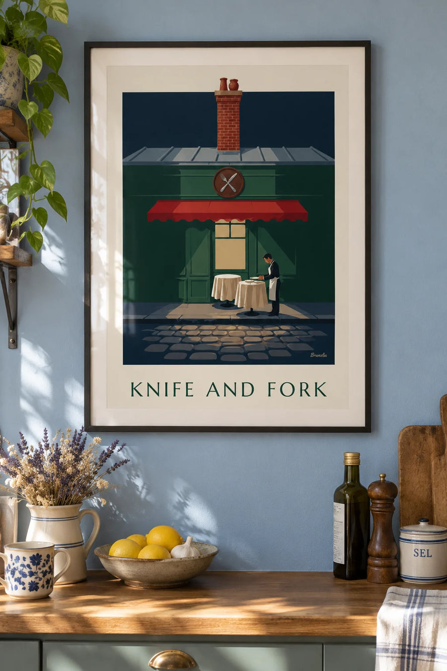 Poster of a silver fork and knife in a Parisian bistro: framed on the wall