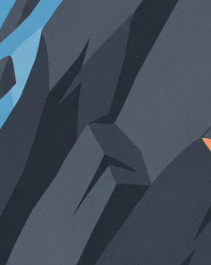 The slate grey facets of the rock face and their angular shadows