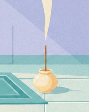 The incense stick in its rounded yellow pot beside the turquoise mat