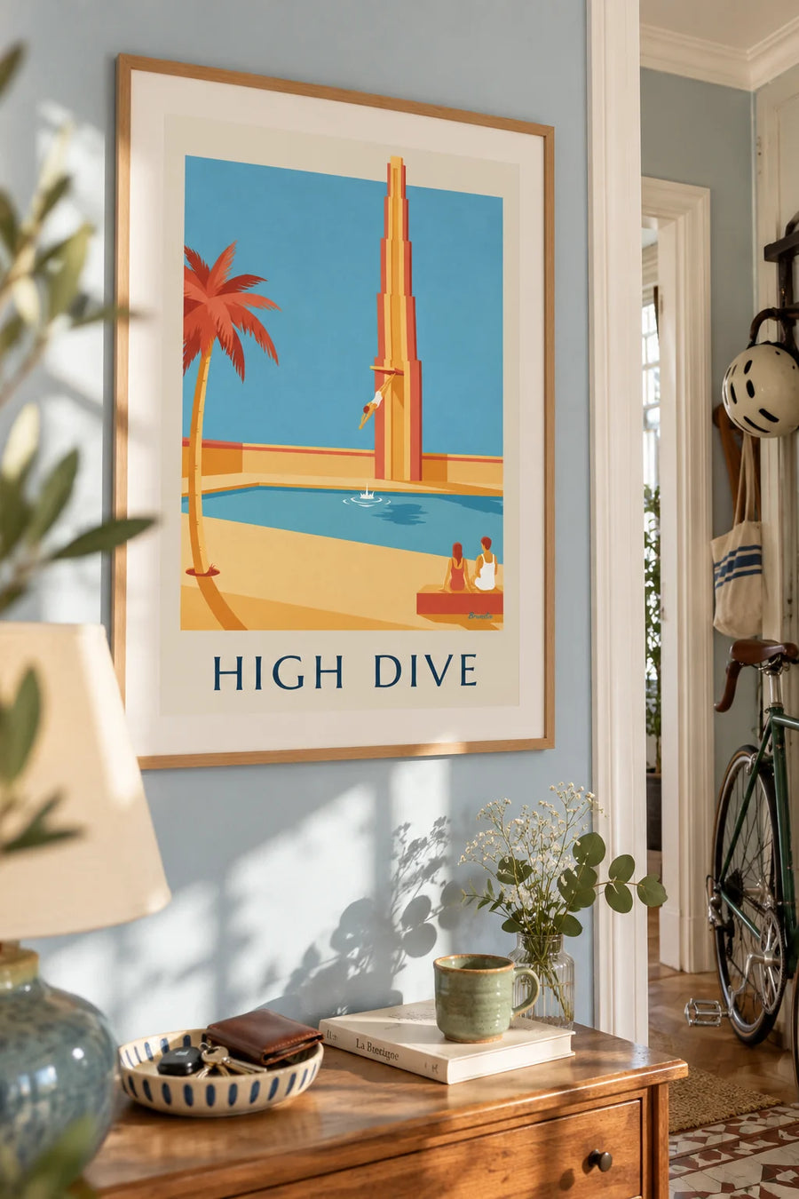 Diver in a swan dive above the pool poster: framed on the wall