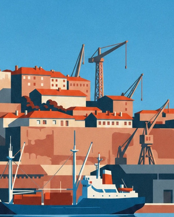 The harbour cranes and houses with orange roofs, with a blue cargo ship moored below