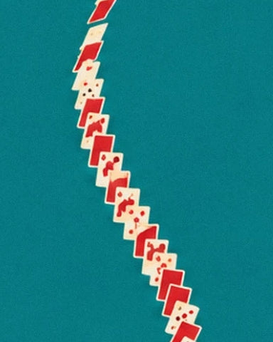 A cascade of red and white cards against the turquoise stage background