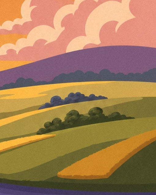 Green and golden fields bordered by groves of trees, beneath mauve hills and a pink sky