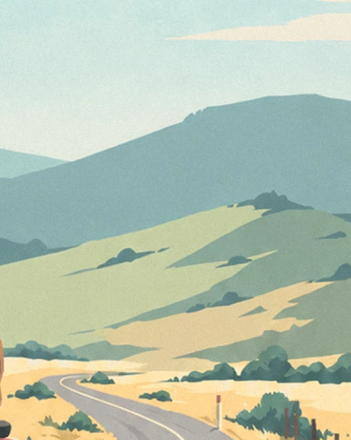 Green and golden hills crossed by a small winding road beneath a pale sky