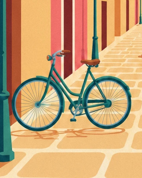 The green bicycle with a brown saddle on the golden cobbles of a lane in Vieux Nice