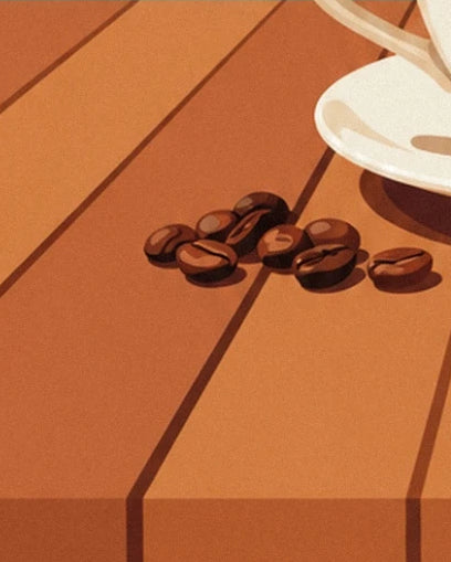 Brown coffee beans on the wooden slats beside the cream saucer