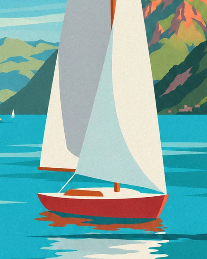 A sailing boat with a red hull and white sails on the turquoise waters of lac d'Annecy