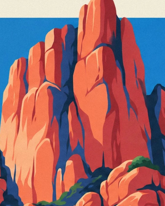 The tall orange rock spires of Piana with deep blue shadows