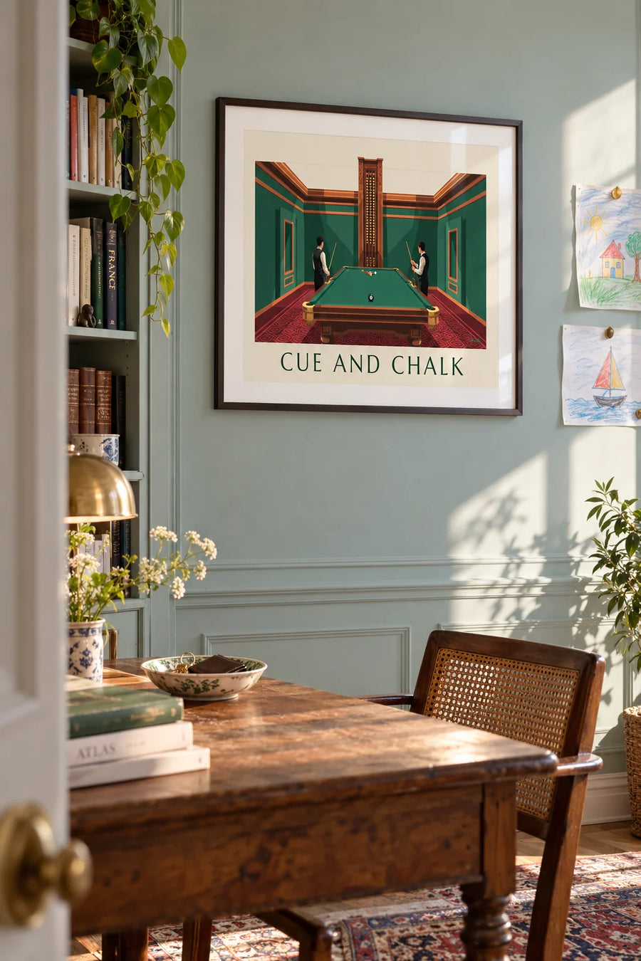 Poster of a billiard room with green walls and an 8 ball on the felt: framed on the wall