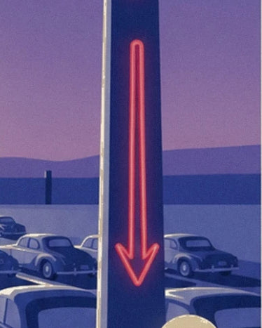 A red illuminated arrow on a pole in front of the cars at the drive-in cinema