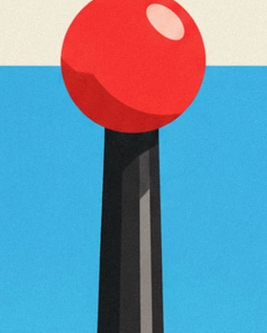 The red joystick ball and its pink reflection on a faceted black shaft