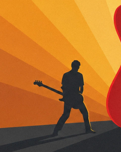 Le guitariste en silhouette noire, basse en main, sur la scène orange