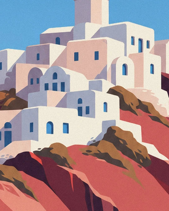 The white and pink houses of Oia with blue windows on the red rocks