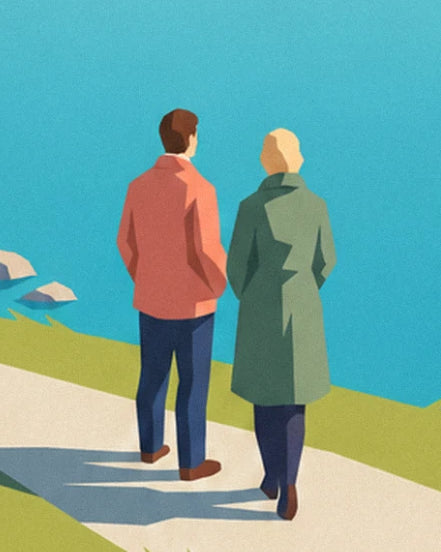 Un couple de dos, veste corail et manteau vert, qui marche sur le sentier au bord du lac