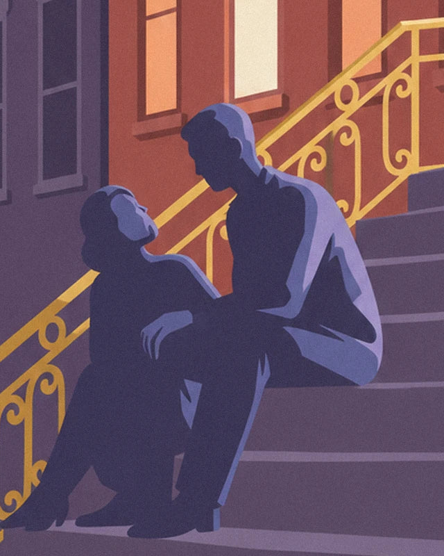 Couple sitting in the shade on the front steps, near the golden railing