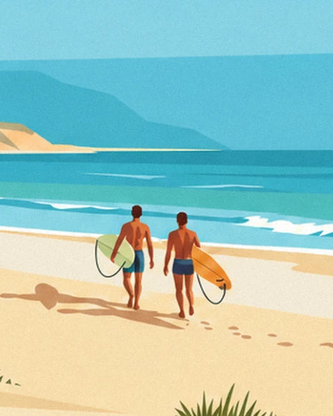 The 2 surfers seen from behind, boards under their arms, walking across the sand towards the ocean