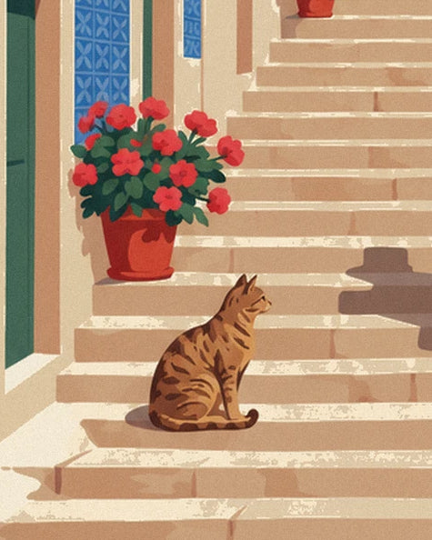 The tabby cat sitting on a step, beside a pot of red geraniums and a wall of blue azulejo tiles