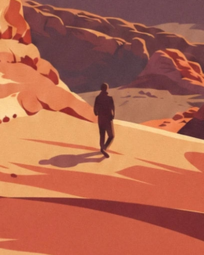 Un marcheur solitaire sur le sable orangé, entre les rochers rouges de l’Utah