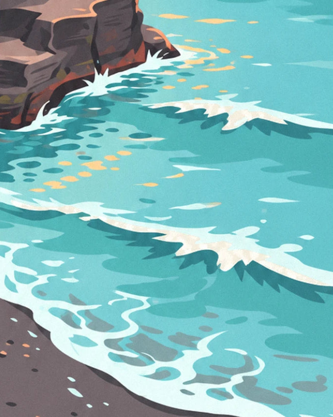 The turquoise waves breaking against the rocks, with their white foam