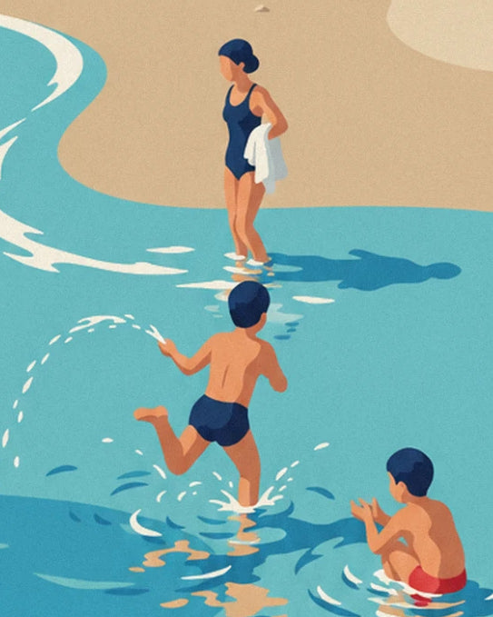 A woman in a navy swimsuit and 2 boys splashing in the turquoise water