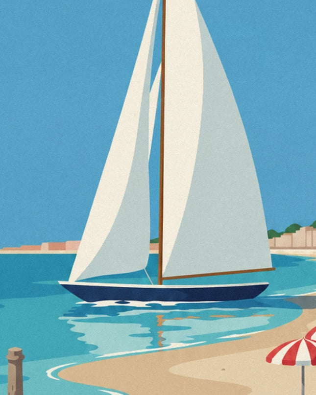 A sailing boat with a navy hull and white sails on the bay's turquoise water