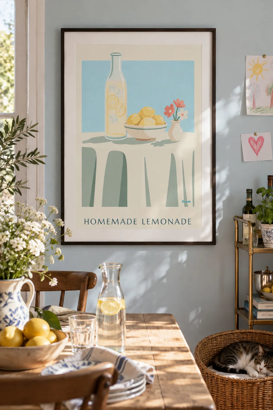 Poster of a carafe of homemade lemonade and a bowl of lemons: framed on the wall