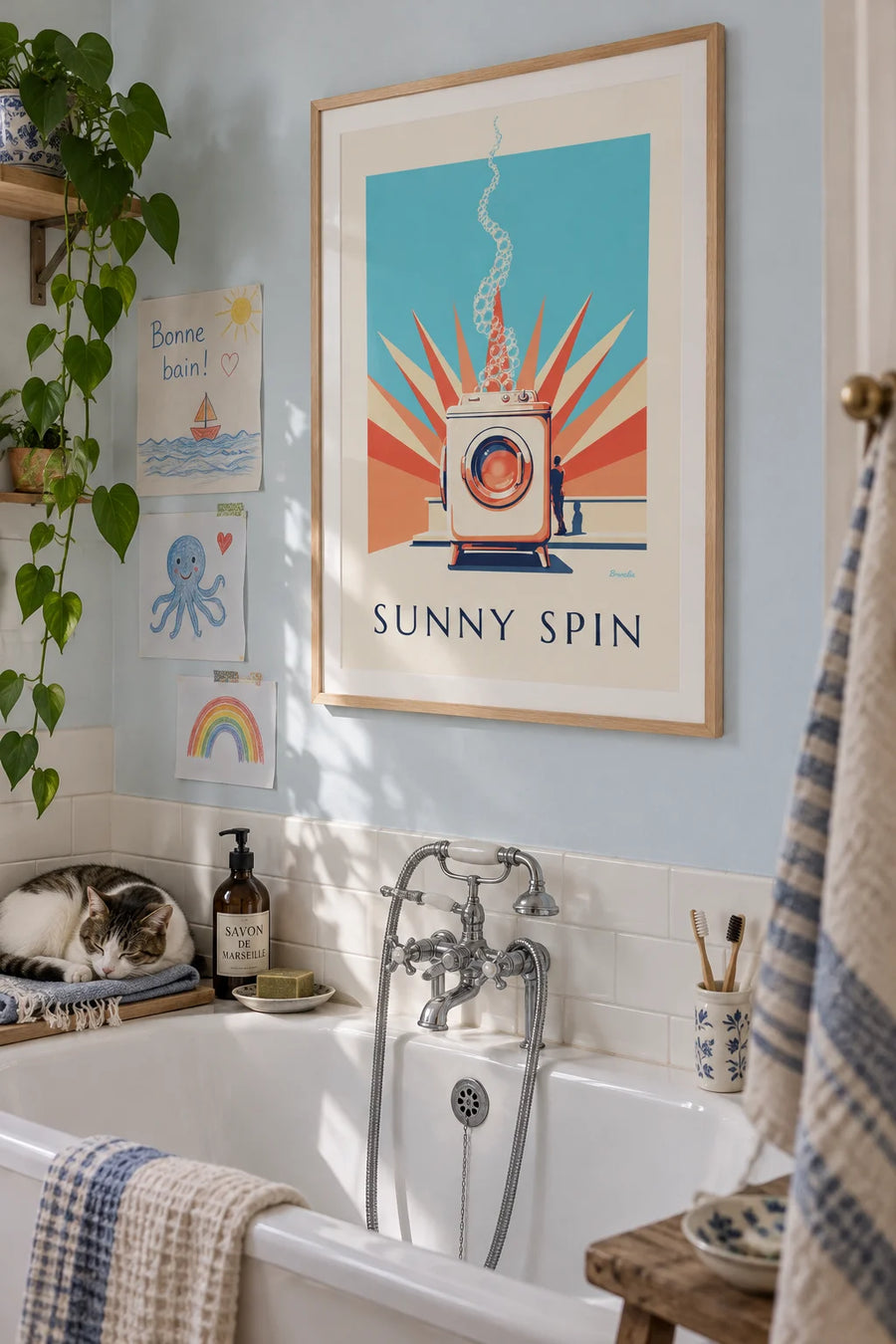 Poster of a porthole washing machine and pastel sunrays: framed on a wall