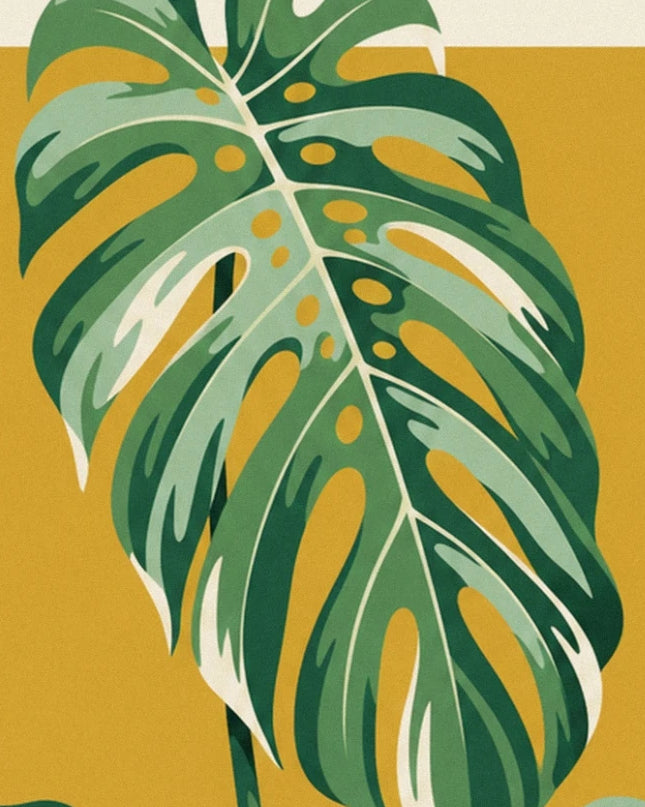 A long monstera leaf with cream veins on a mustard yellow background
