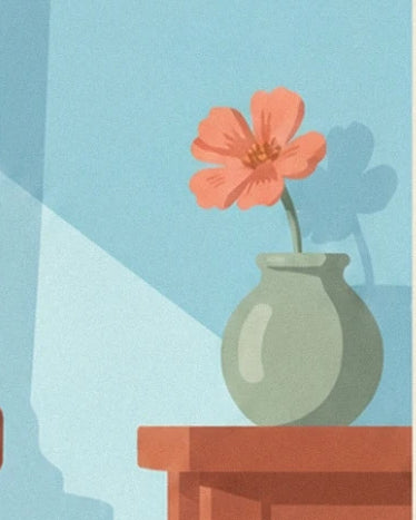 A coral flower in a green vase on a reddish wooden cabinet