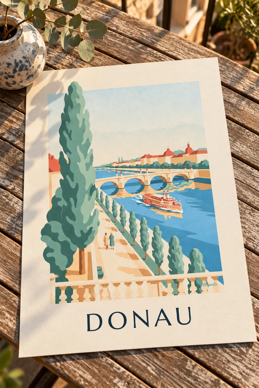 Poster wandeling langs de Donau en raderstoomboot: op een tafel gezet