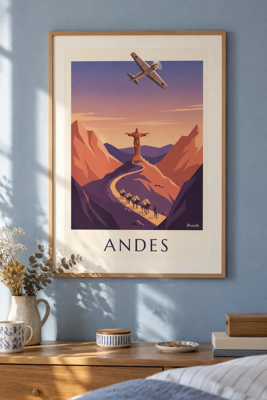 Poster of an airmail plane and a mule caravan in the Andes: framed on the wall