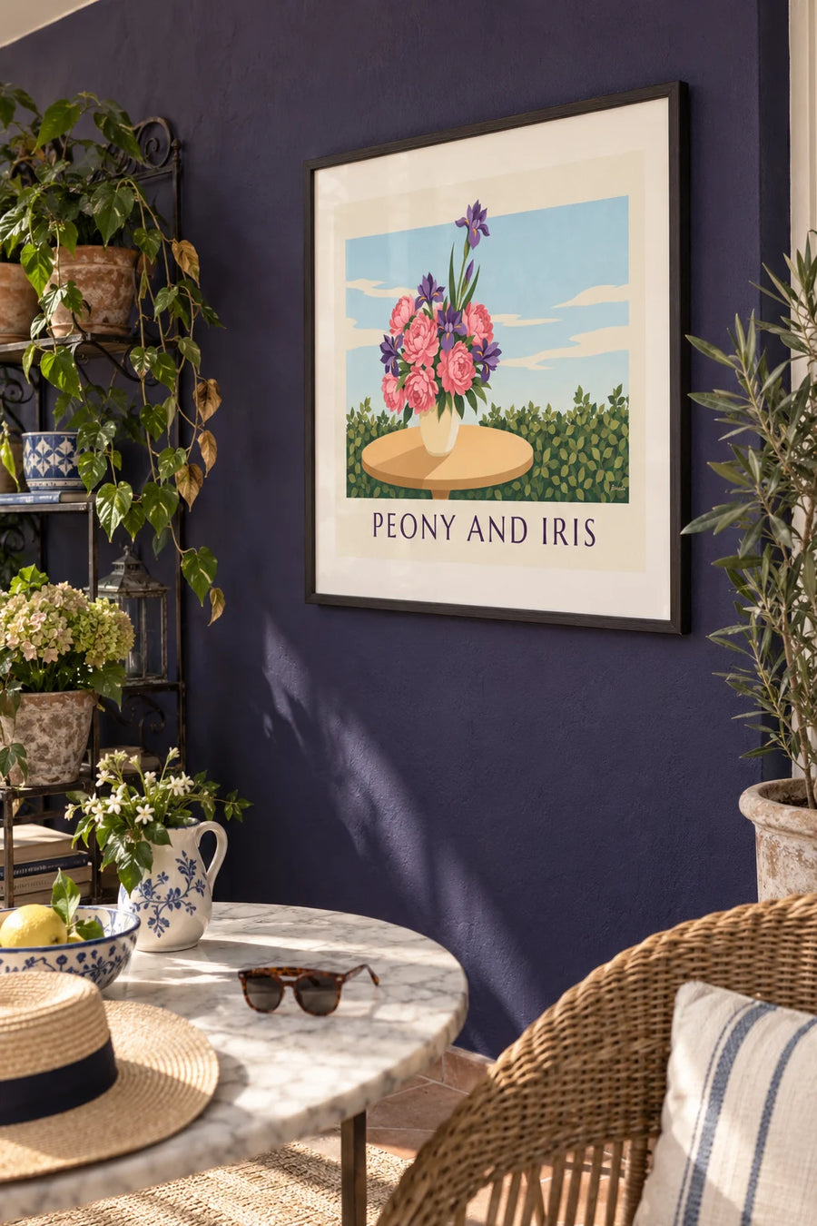 Poster of a bouquet of pink peonies and purple irises: framed on the wall