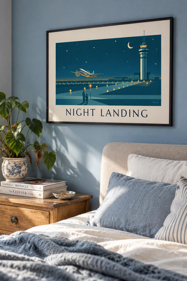 Poster of an airliner landing at night on a lit runway: framed on the wall