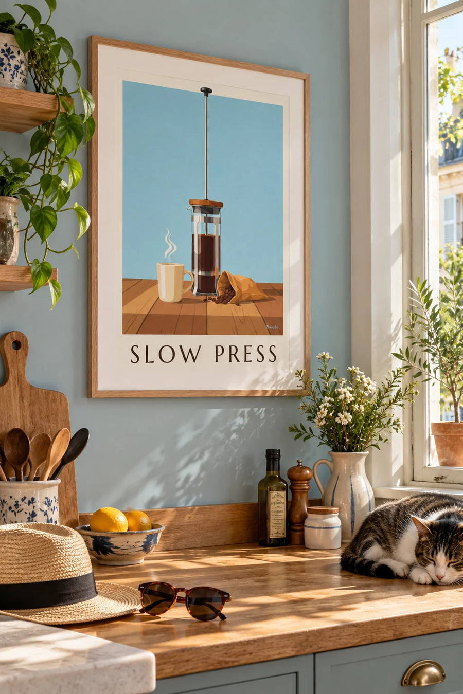 Poster of a French press coffee maker on a rustic wooden table: framed on a wall