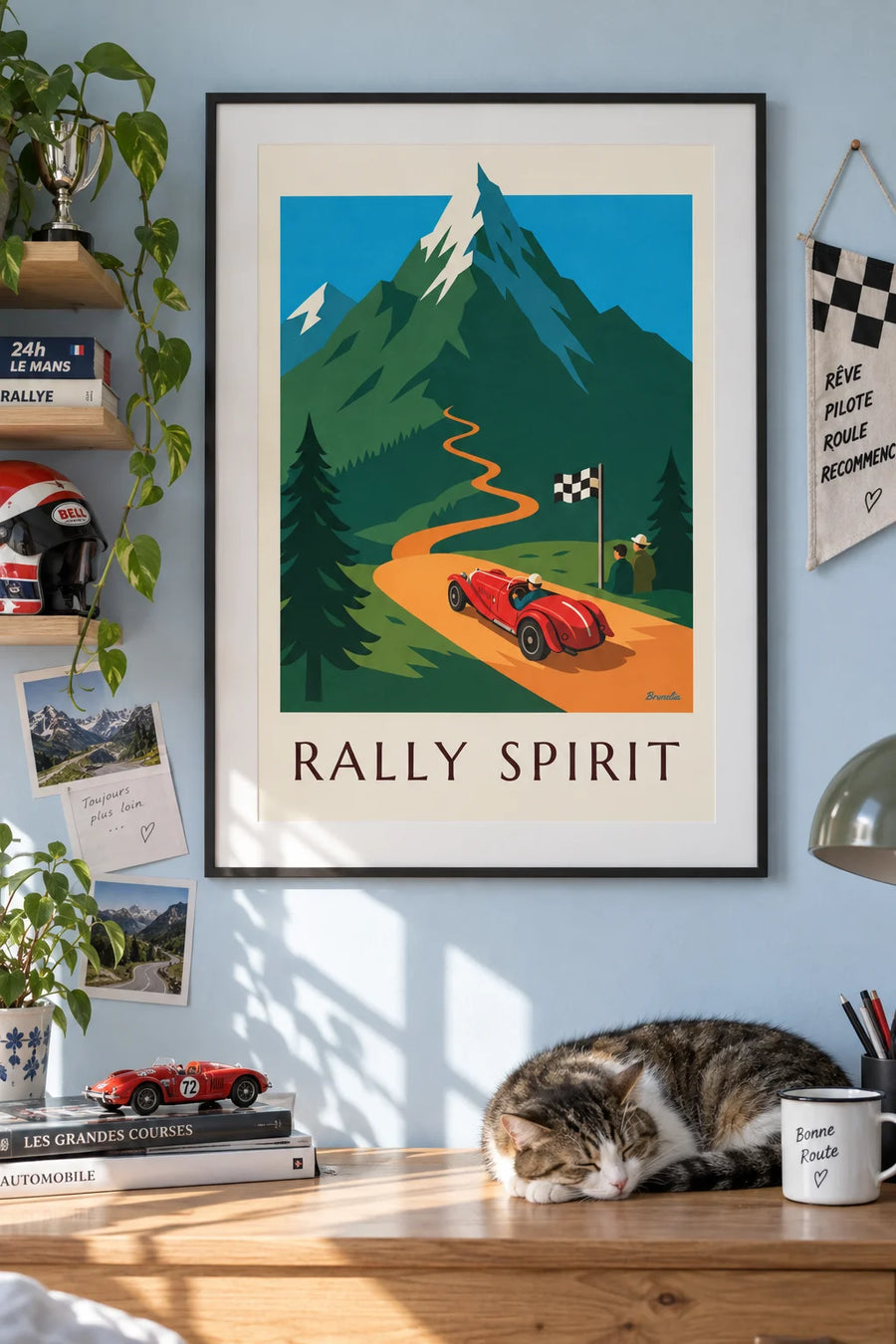 Poster of a red roadster in a mountain car rally: framed on the wall