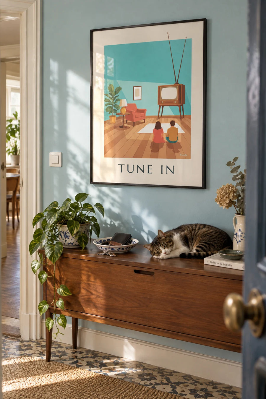 Poster of a wooden TV with an antenna and rotary knobs: framed on the wall