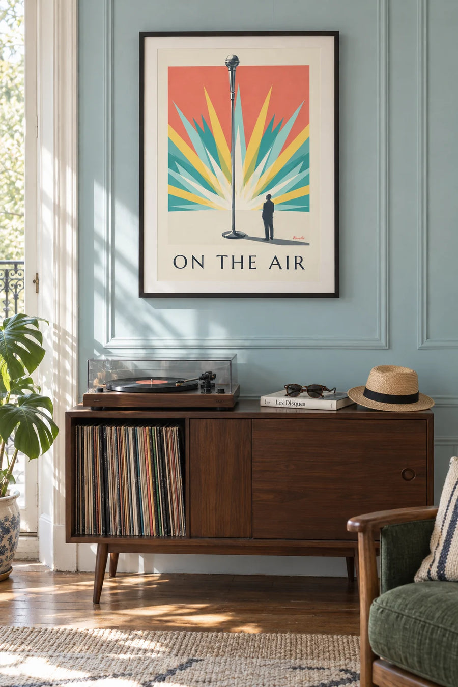 Poster of a chrome microphone on a radiating background: framed on the wall