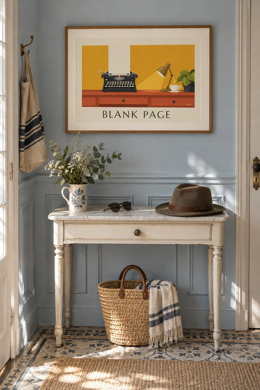 Poster of a typewriter and blank sheet of paper on a desk: framed on a wall